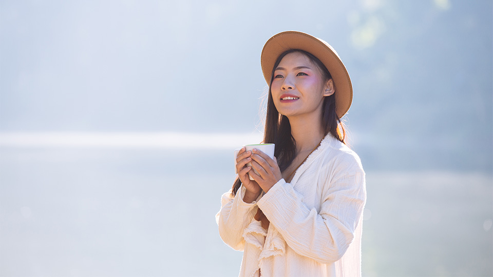 woman drinking tea thinking