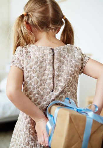 little girl giving present